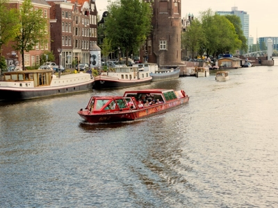 City sightseeing preview boat on canal open roof explore hop on