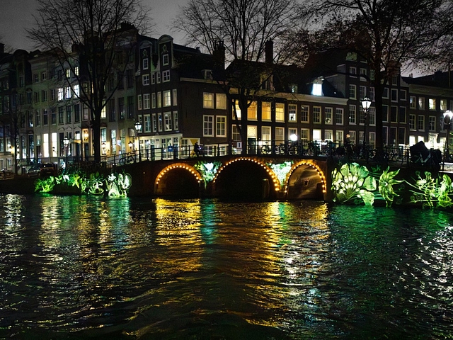 Amsterdam light festival bridge with green neon art