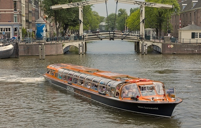 Lovers canal cruise at wooden bridge amsterdam boat NAV BAR